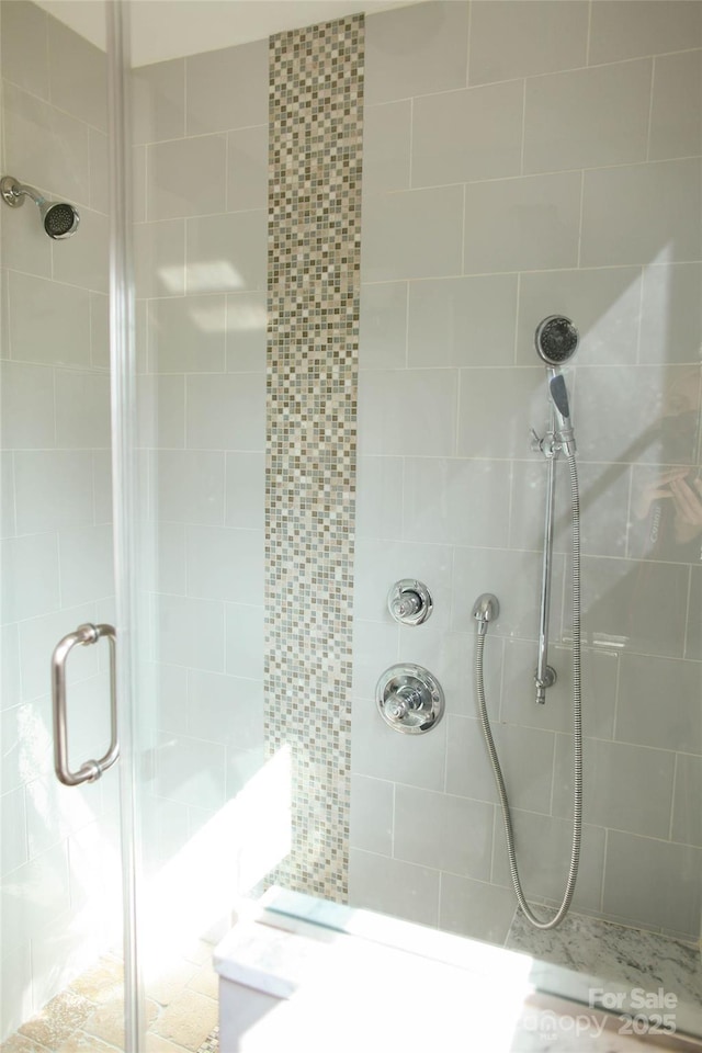 full bath featuring a shower stall