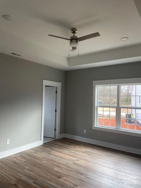 empty room with wood-type flooring and ceiling fan