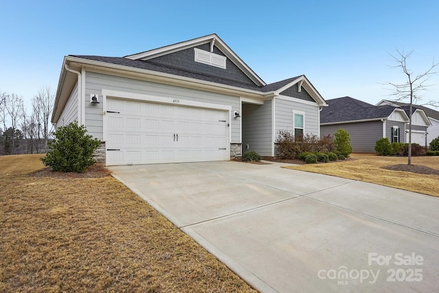 single story home featuring a garage and a front lawn