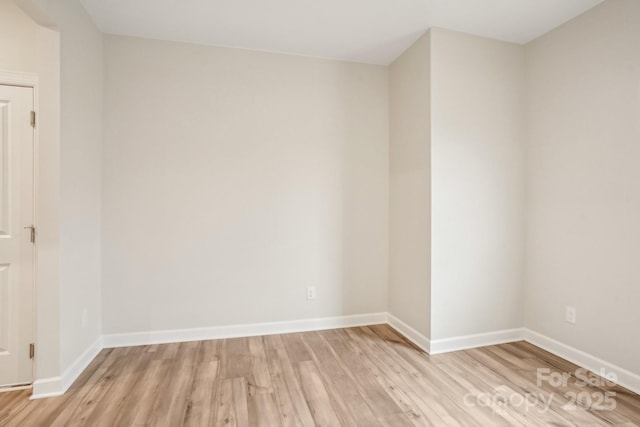 empty room with light hardwood / wood-style floors