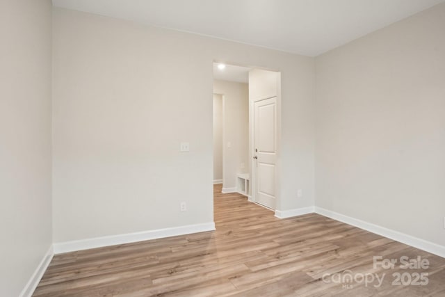 unfurnished room featuring light hardwood / wood-style floors