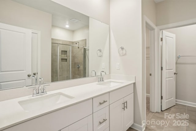 bathroom with vanity, tile patterned flooring, and a shower with shower door