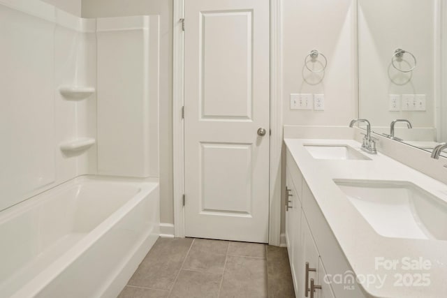 bathroom with shower / tub combination, tile patterned floors, and vanity