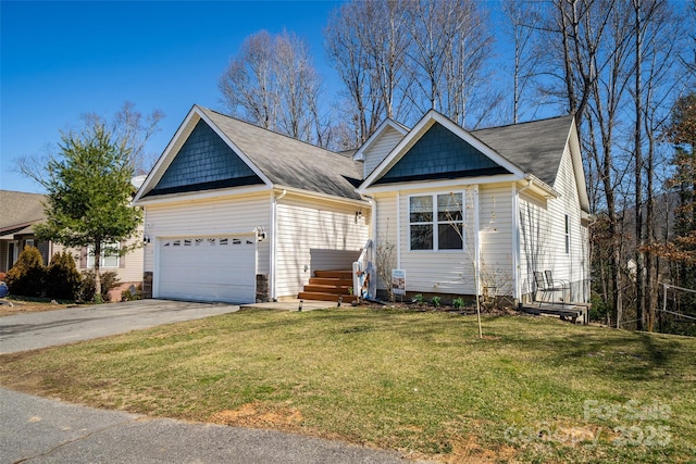 view of front of house featuring driveway, a garage, and a front lawn