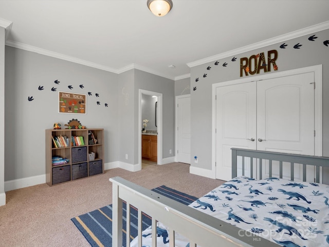 bedroom featuring connected bathroom, light colored carpet, baseboards, ornamental molding, and a closet