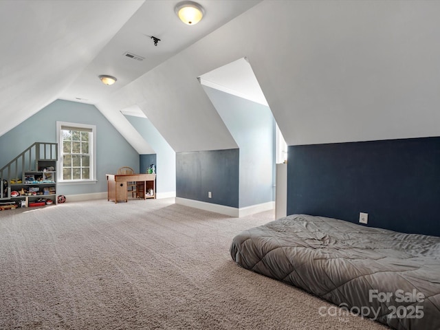 bedroom featuring carpet, visible vents, vaulted ceiling, and baseboards