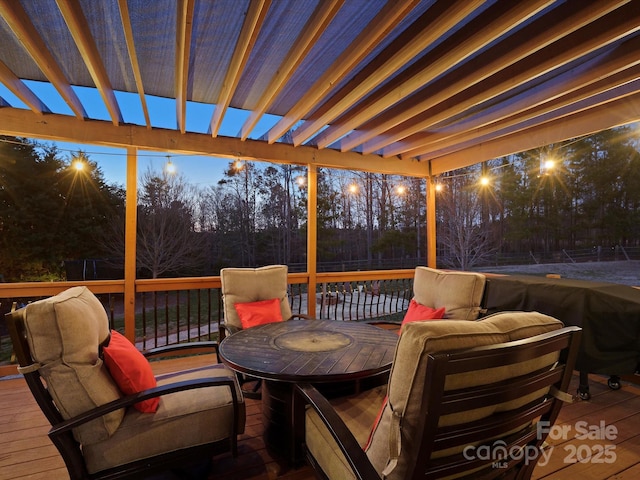 wooden deck with outdoor lounge area and fence