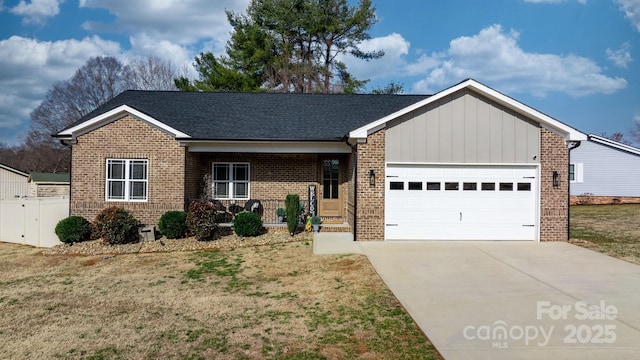 view of front facade with a garage and a front lawn