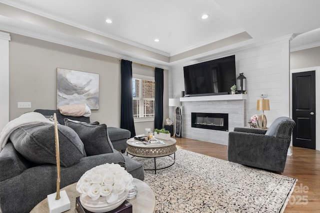 living room featuring ornamental molding and hardwood / wood-style floors