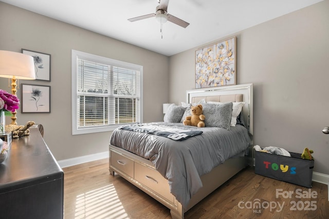 bedroom with hardwood / wood-style floors and ceiling fan