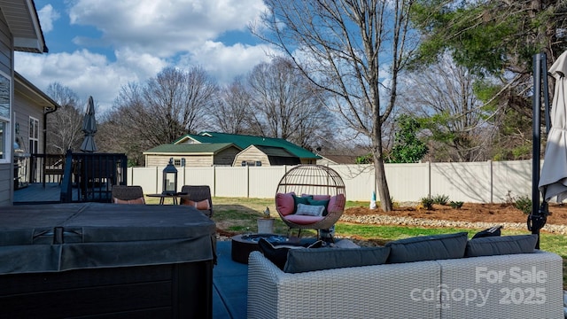 exterior space with outdoor lounge area and a hot tub