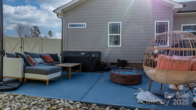 view of patio / terrace featuring an outdoor living space with a fire pit