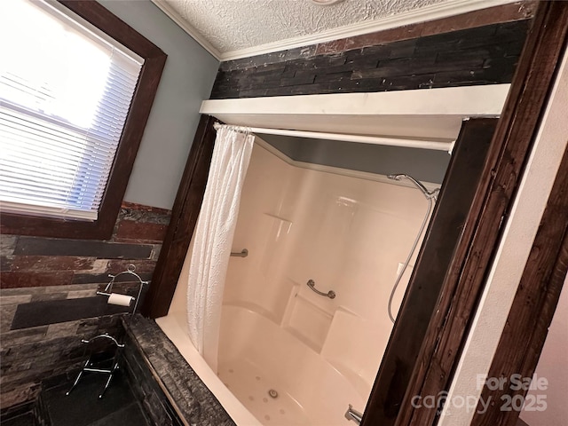 bathroom featuring shower / tub combo, crown molding, and a textured ceiling