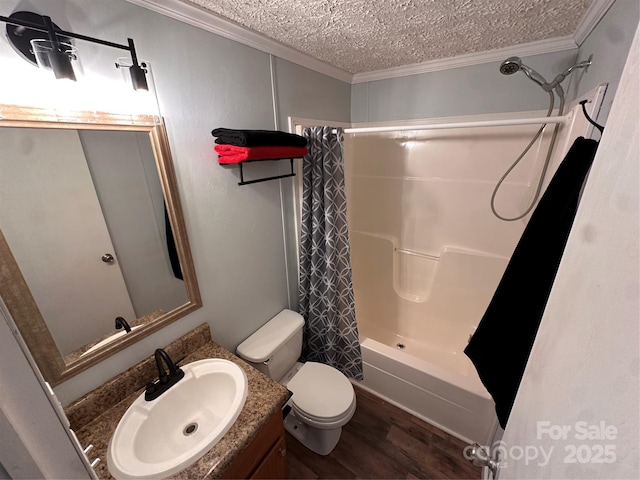 full bathroom featuring shower / tub combo with curtain, hardwood / wood-style floors, vanity, ornamental molding, and a textured ceiling