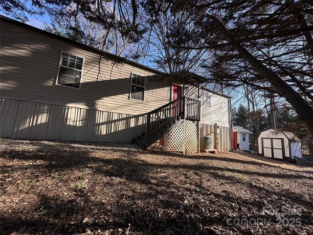 view of property exterior with a storage shed