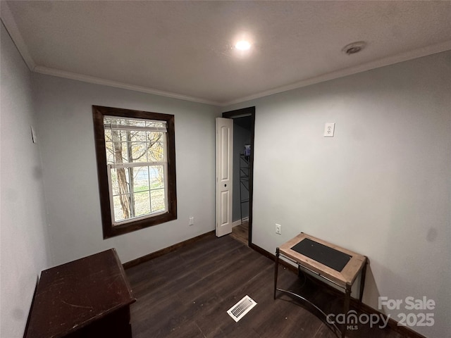 interior space with crown molding and dark hardwood / wood-style flooring