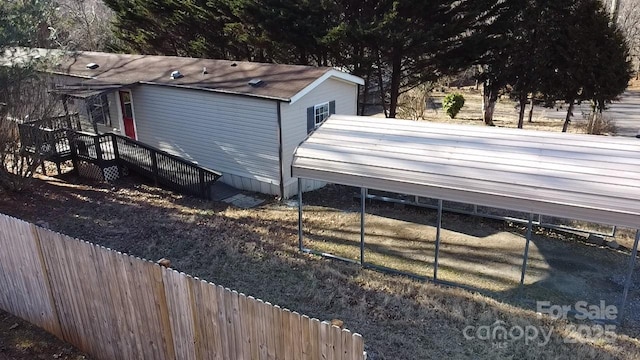 exterior space with a carport