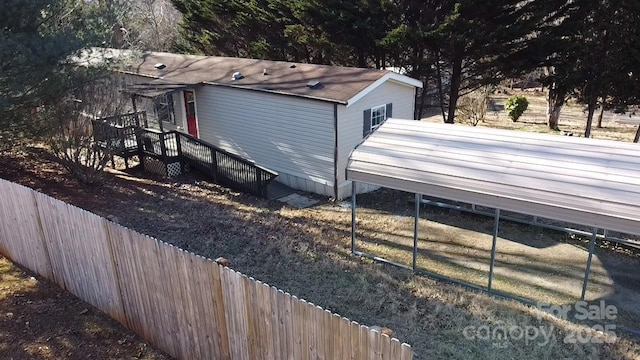 exterior space with a carport