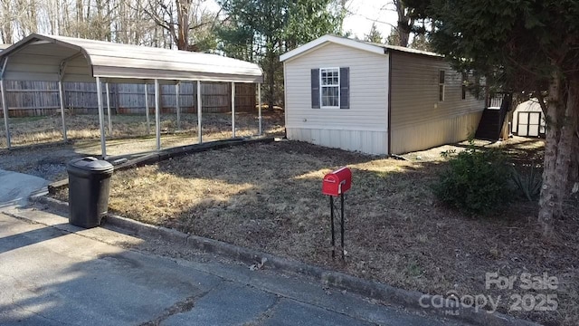 view of outbuilding featuring a carport