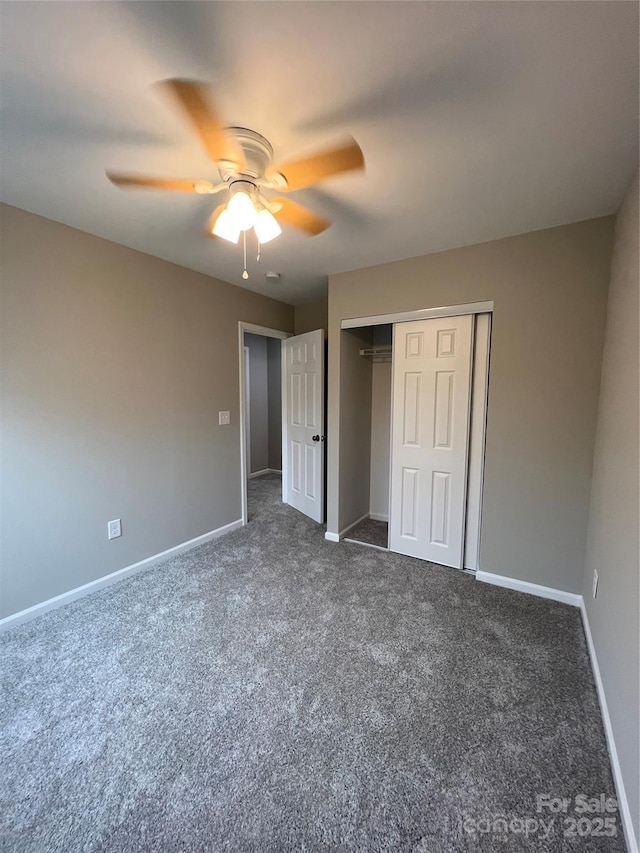 9103 Exbury Ct, Charlotte, NC 28269 - unfurnished bedroom with dark carpet, a closet, and ceiling fan