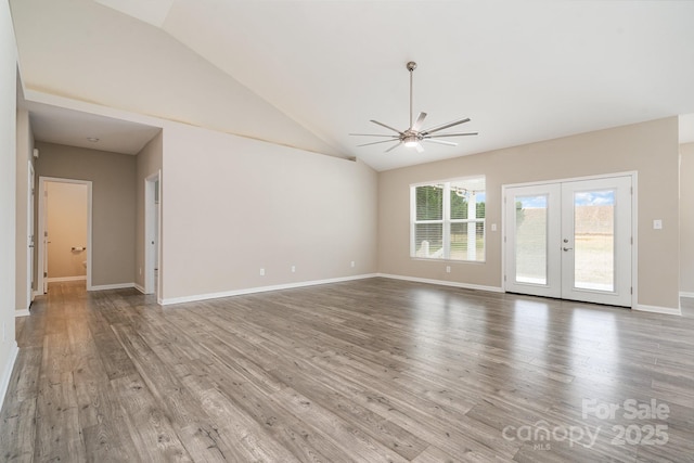 interior space with high vaulted ceiling, light hardwood / wood-style floors, french doors, and ceiling fan