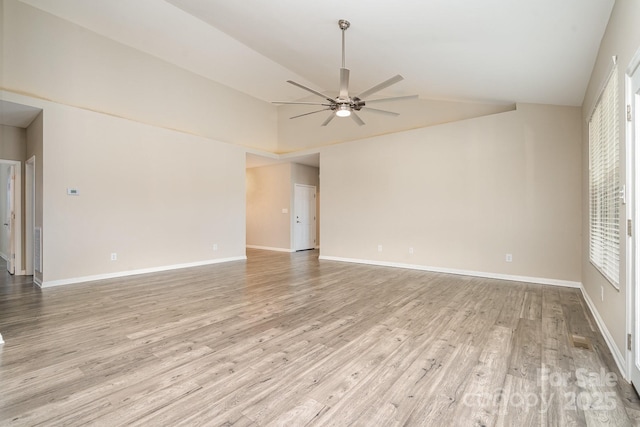 unfurnished room with ceiling fan, high vaulted ceiling, and light hardwood / wood-style floors