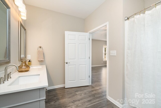 bathroom featuring vanity and hardwood / wood-style floors