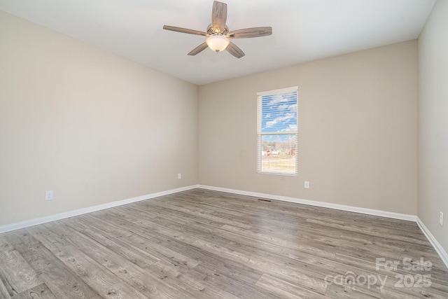 unfurnished room featuring ceiling fan and light hardwood / wood-style flooring