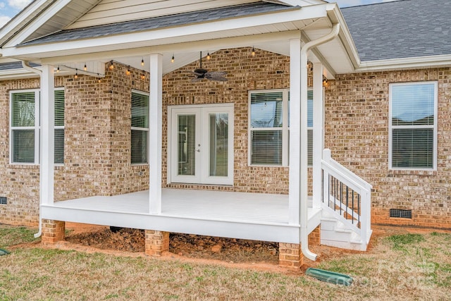 view of exterior entry featuring ceiling fan