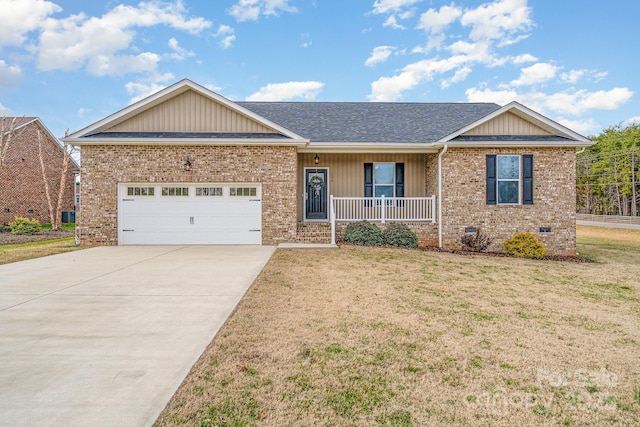 single story home featuring a garage, a front lawn, and a porch