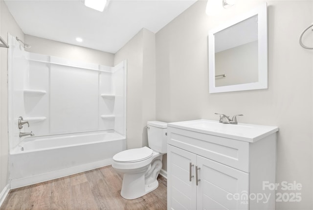 full bathroom featuring shower / bathing tub combination, vanity, toilet, and wood finished floors