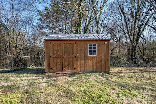 view of shed with a fenced backyard