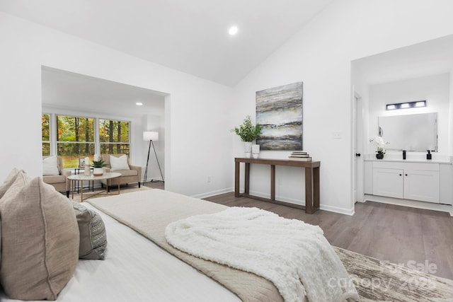 bedroom with dark wood-type flooring and high vaulted ceiling