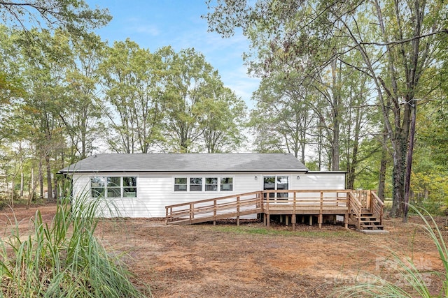 rear view of property with a deck