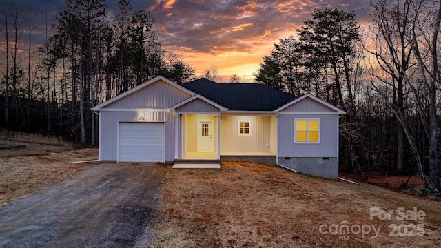 single story home with crawl space, driveway, an attached garage, and roof with shingles