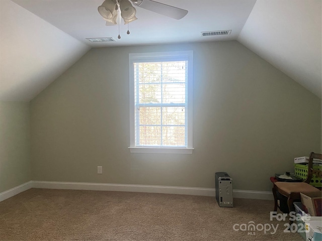 bonus room with ceiling fan, lofted ceiling, and carpet floors