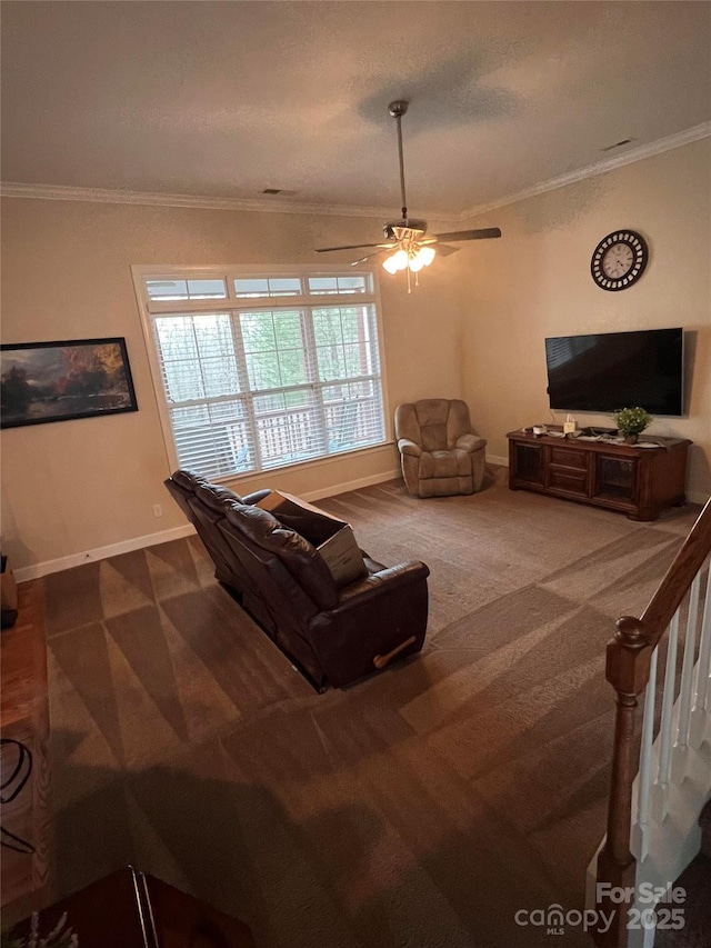 carpeted living room featuring crown molding and ceiling fan