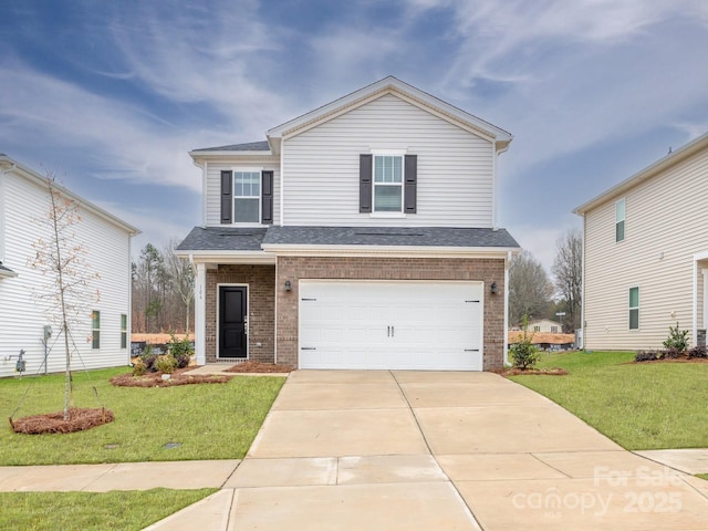 view of front of home with a garage and a front lawn