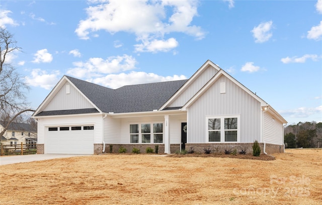 modern farmhouse with a garage, brick siding, roof with shingles, and concrete driveway