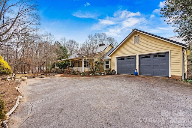 view of front of property with a garage and a porch