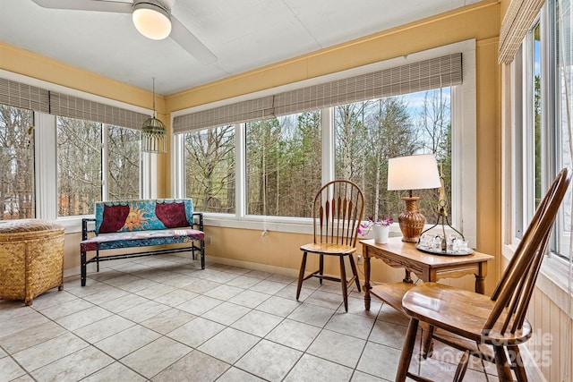 sunroom / solarium with ceiling fan and a healthy amount of sunlight