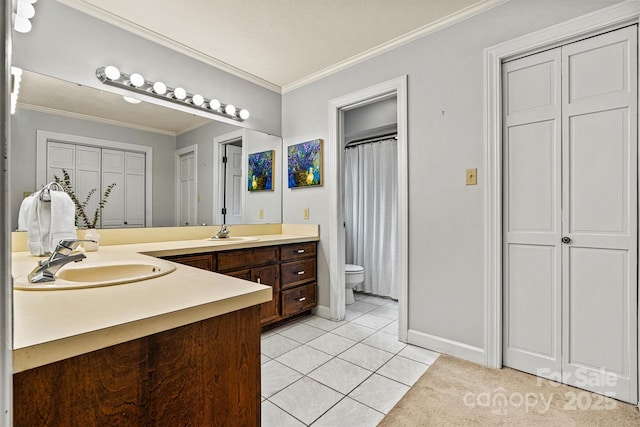 bathroom featuring tile patterned floors, toilet, crown molding, a textured ceiling, and vanity