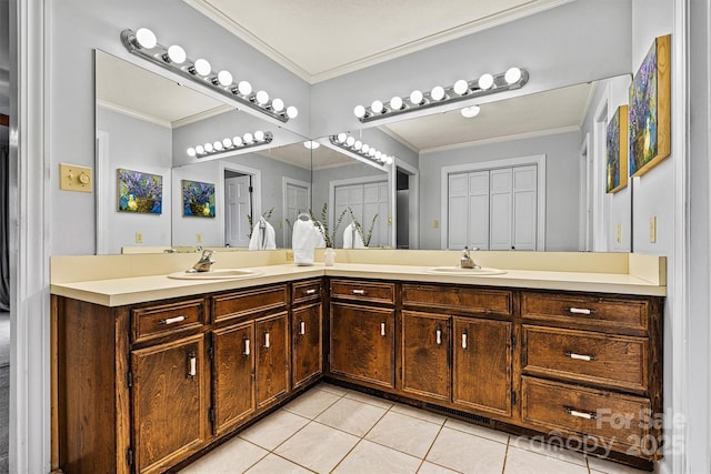 bathroom with tile patterned flooring, crown molding, and vanity