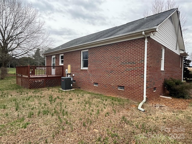 view of home's exterior featuring central AC, crawl space, brick siding, and a deck