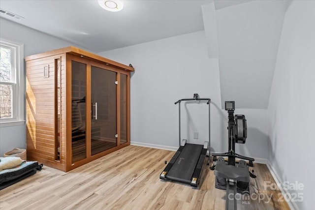 workout area featuring light hardwood / wood-style floors