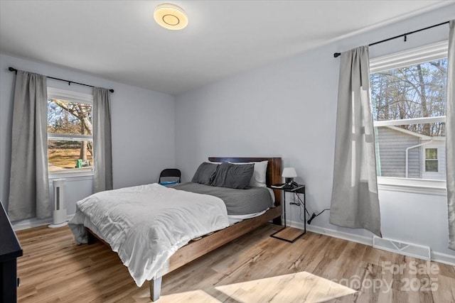 bedroom with light hardwood / wood-style floors