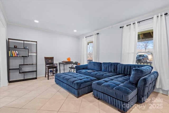 living room with ornamental molding and light tile patterned flooring