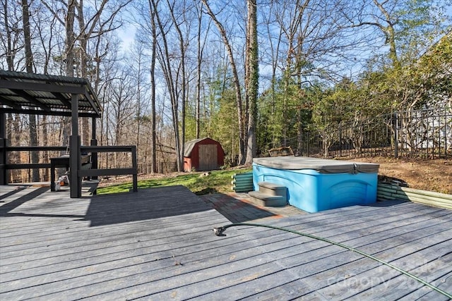 wooden terrace featuring a shed