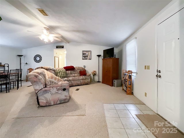 carpeted living room with ceiling fan and vaulted ceiling with beams