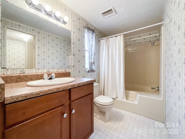 full bathroom with vanity, toilet, shower / bath combination with curtain, and a textured ceiling